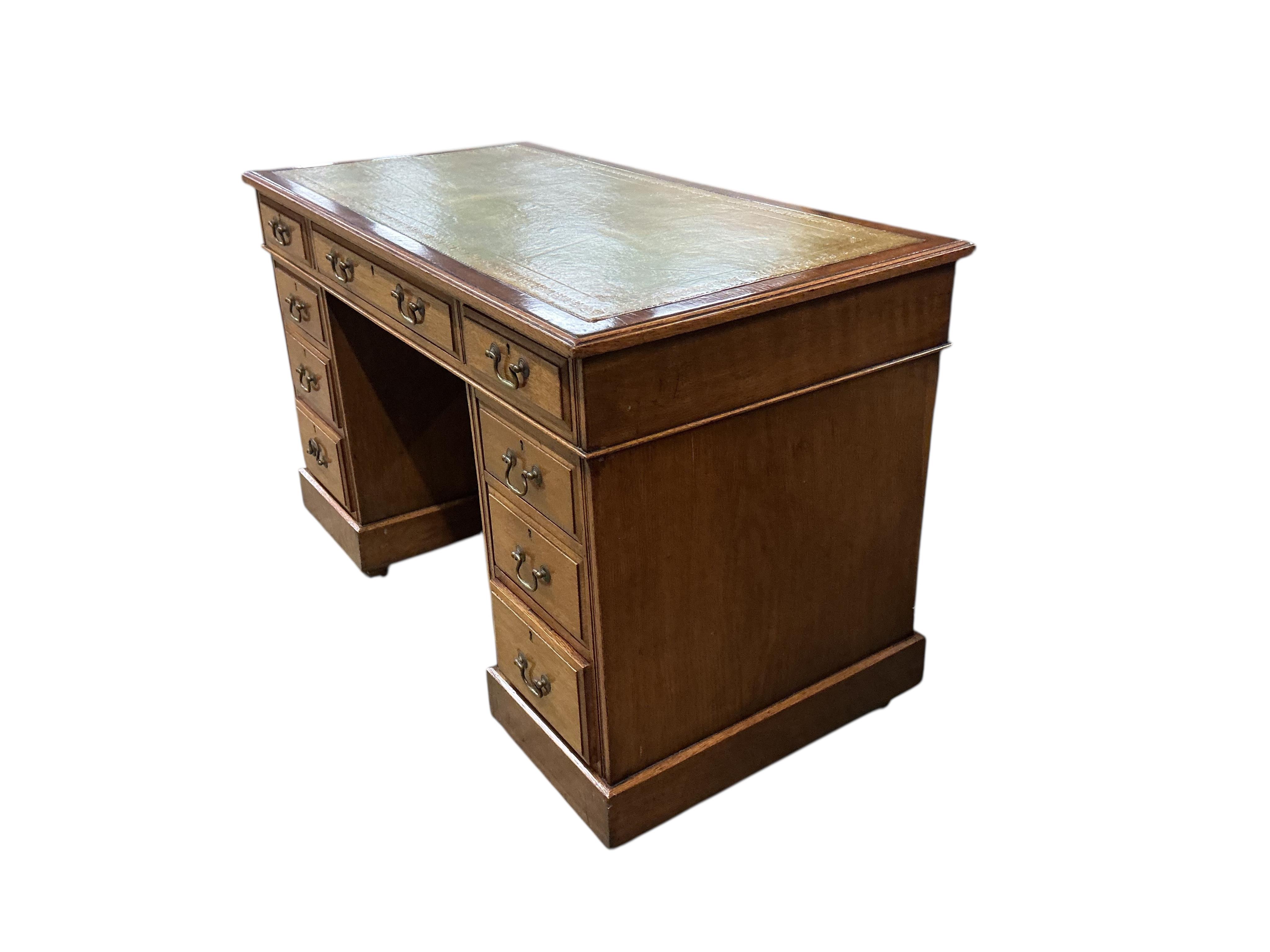 An early 20th century oak pedestal desk, width 122cm, depth 60cm, height 75cm